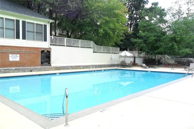 a view of a swimming pool with a patio