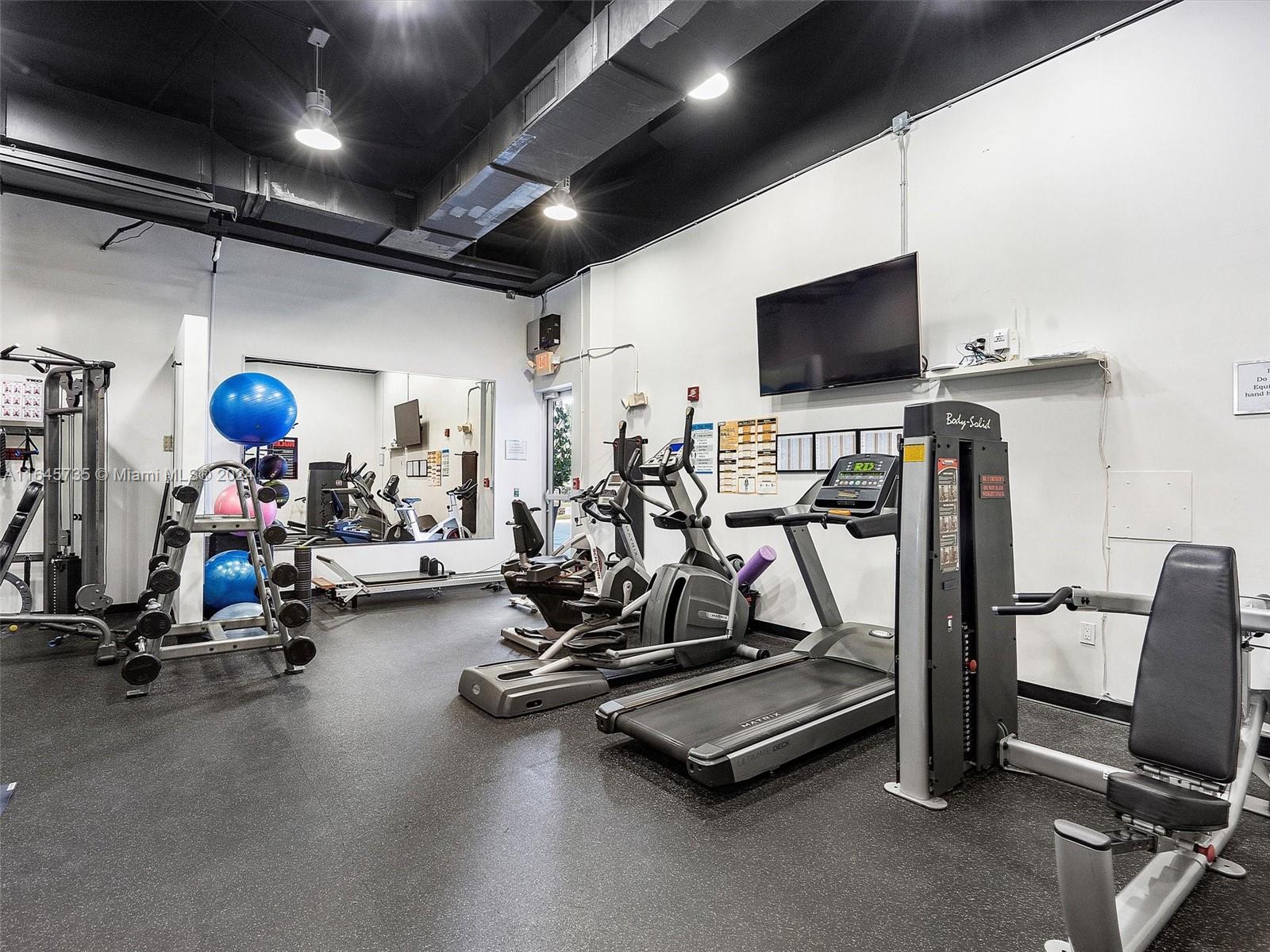 2001 Meridian Avenue, Unit 306 Miami Beach, FL 33139 - Photo 16 of 17 a view of a room with gym equipment