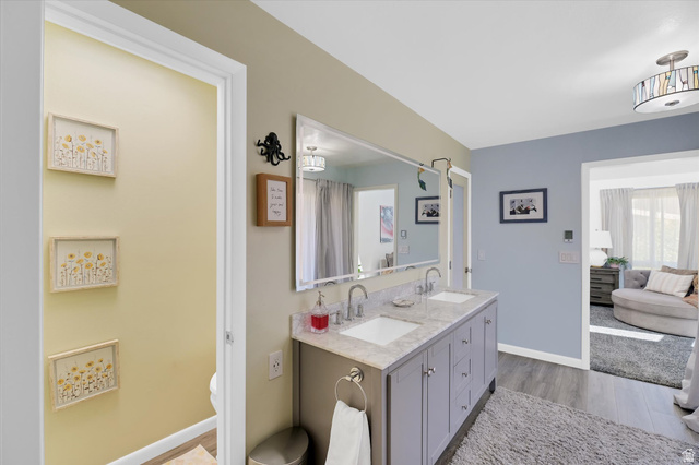 510 Spring Creek Road Providence, UT 84332 - Photo 27 of 97 Dual vanity with undermount sinks, stone-finish countertop, and chrome fixtures