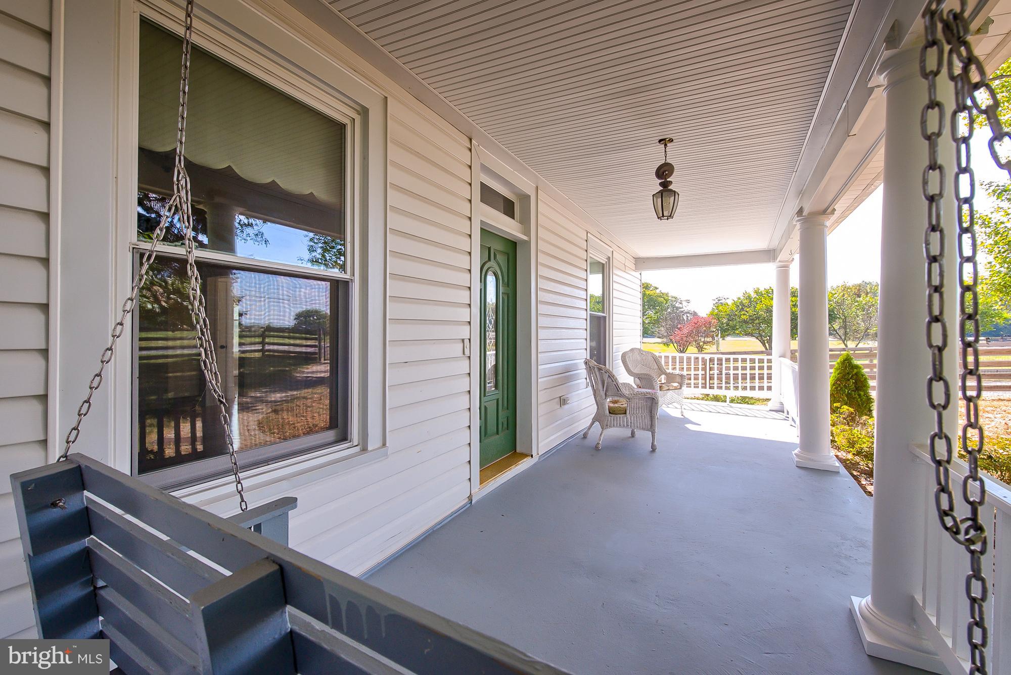 21521 Peach Tree Road Dickerson, MD 20842 - Photo 5 of 30 Front porch swing conveys!