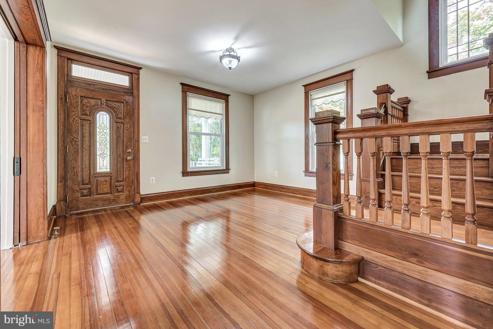 21521 Peach Tree Road Dickerson, MD 20842 - Photo 7 of 30 Grand foyer features hardwoods and gorgeous trim.
