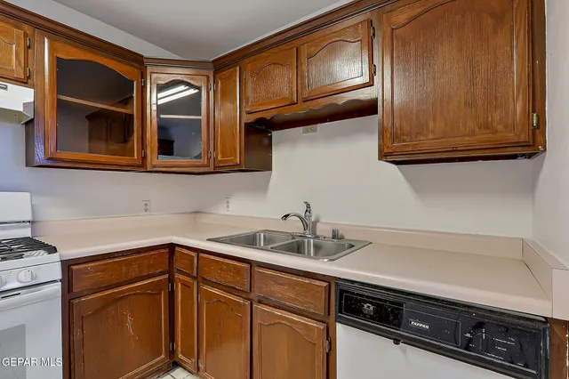a view of a livingroom with a chandelier fan and window