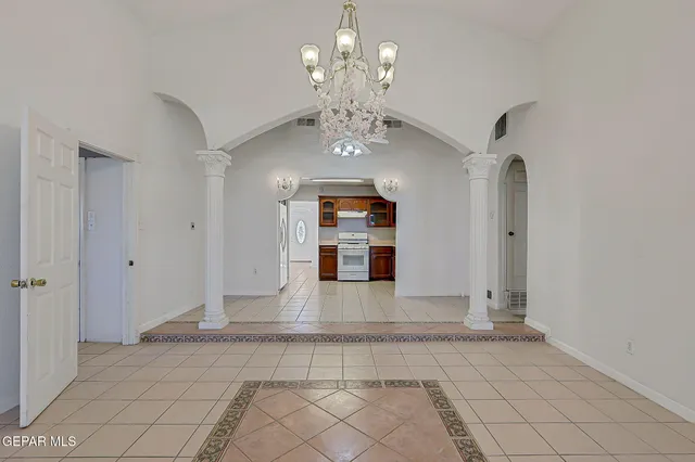 a view of an empty room with a fireplace