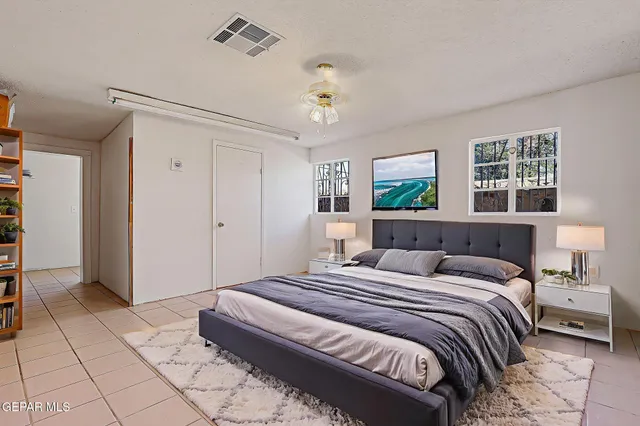 a view of an empty room with a fan