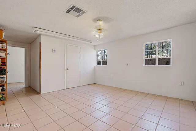 a bathroom with a toilet sink vanity and mirror
