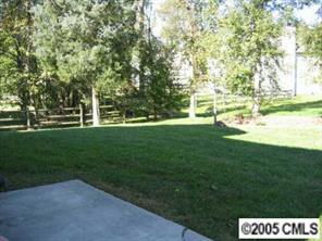 10411 Hellebore Road Charlotte, NC 28213 - Photo 7 of 8 a view of grassy field with benches