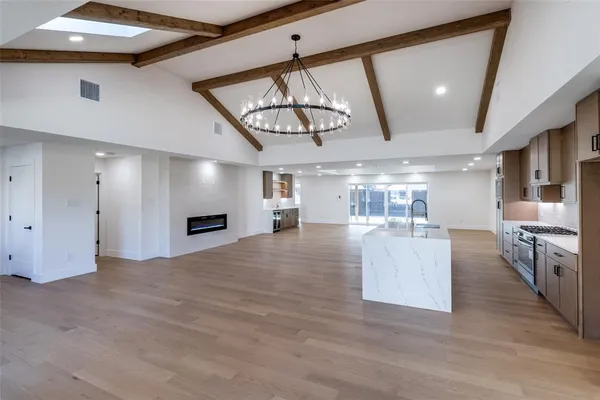 a view of a living room and kitchen