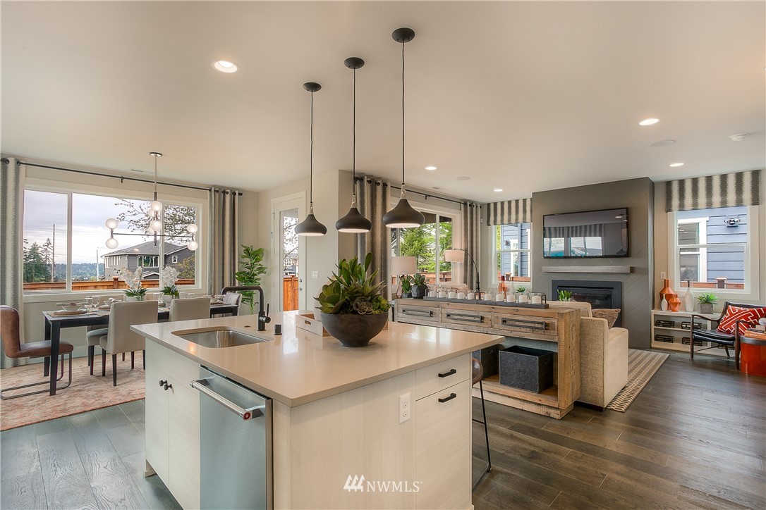 22324 44th Drive Southeast Bothell, WA 98021 - Photo 2 of 11 a kitchen with stainless steel appliances granite countertop a stove and chairs