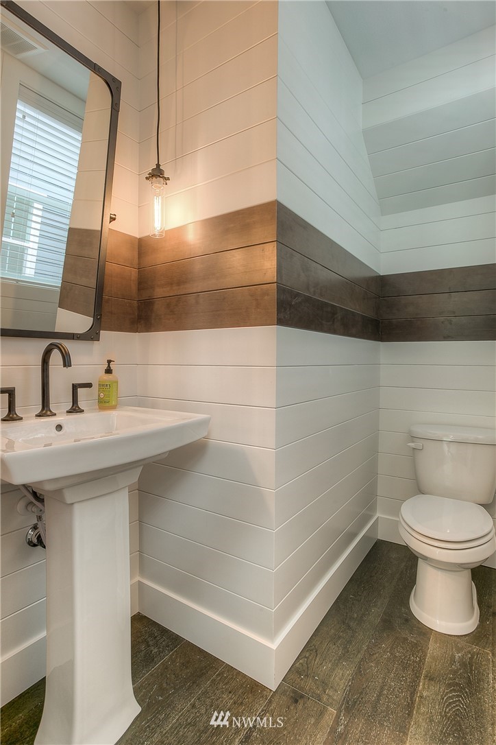 22324 44th Drive Southeast Bothell, WA 98021 - Photo 5 of 11 a bathroom with a sink a toilet and mirror