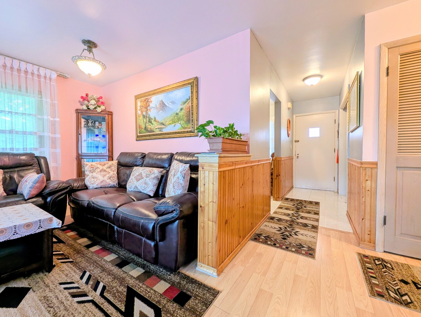 4229 North Keystone Avenue, Unit 3H Chicago, IL 60641 - Photo 7 of 22 a living room with furniture and a rug