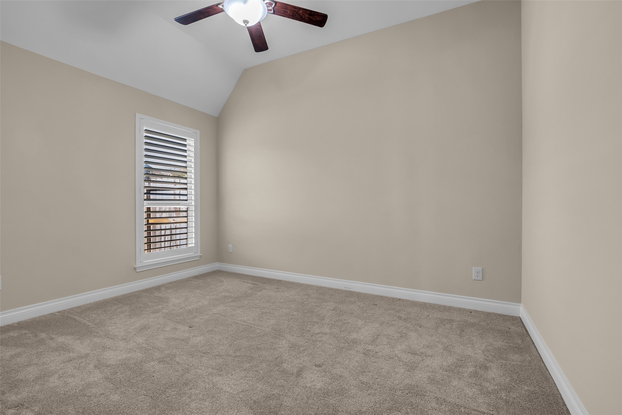 6306 Fisher Bend Lane Rosenberg, TX 77471 - Photo 17 of 26 Another secondary bedroom features carpeted flooring, providing a comfortable and versatile space for family or guests.