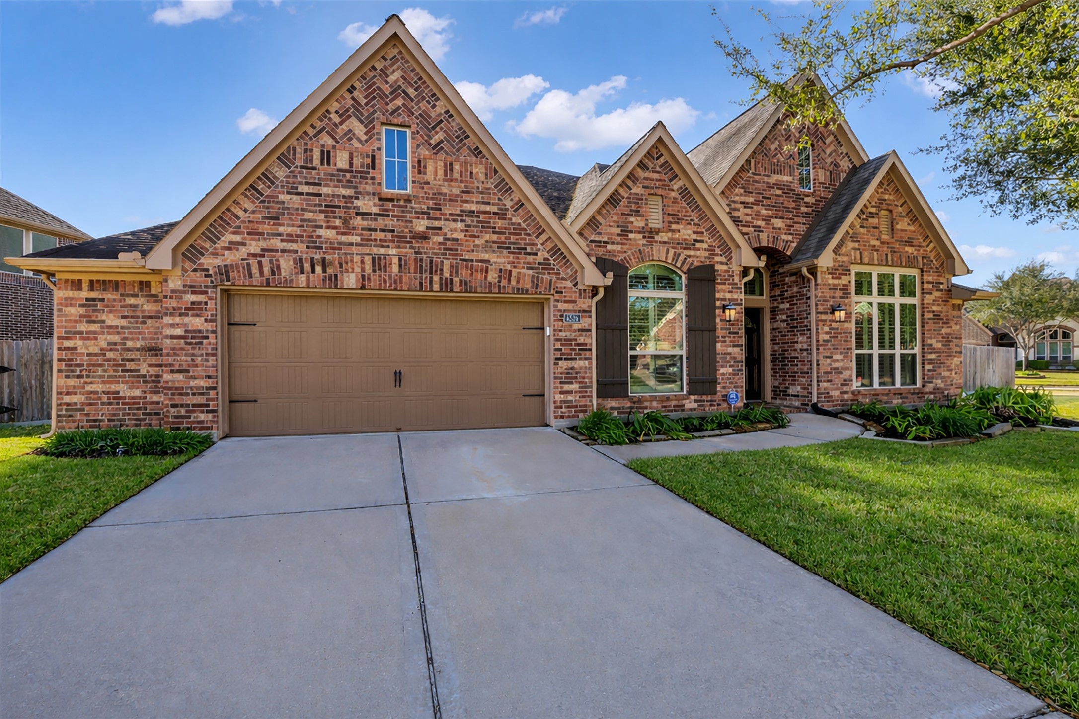 6306 Fisher Bend Lane Rosenberg, TX 77471 - Photo 2 of 26 This home features eye-catching curb appeal with a welcoming exterior, attractive landscaping, and a well-maintained façade that creates a strong first impression.