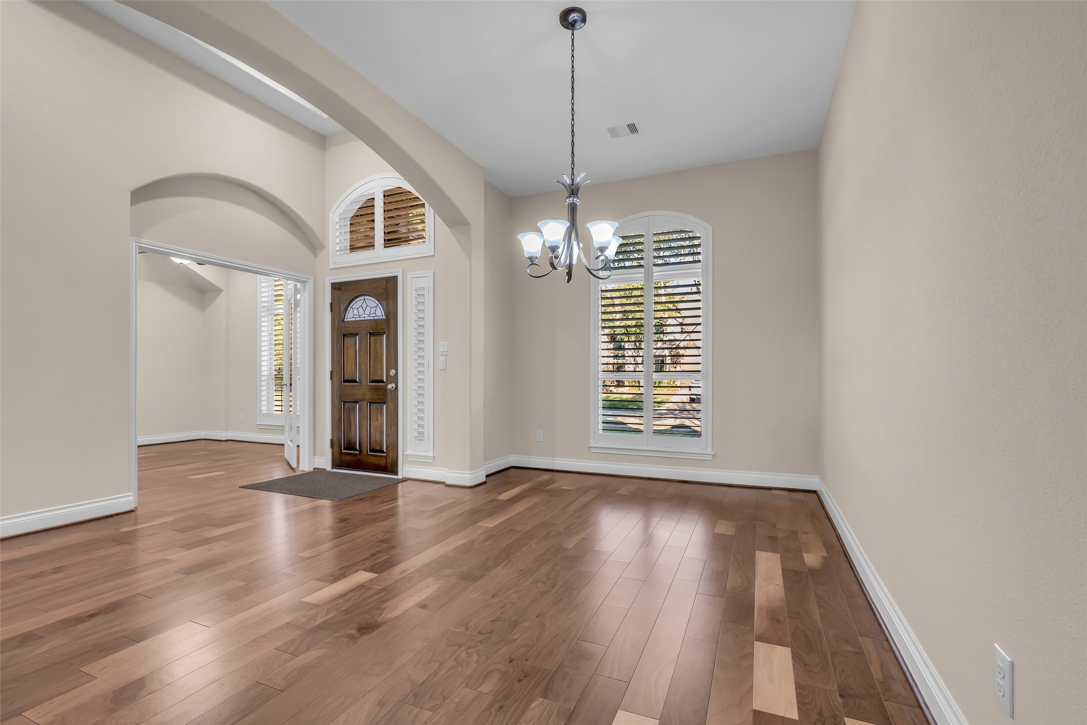 6306 Fisher Bend Lane Rosenberg, TX 77471 - Photo 4 of 26 This view highlights the foyer and adjacent formal dining room, showcasing an open flow that’s well suited for both daily use and hosting guests.