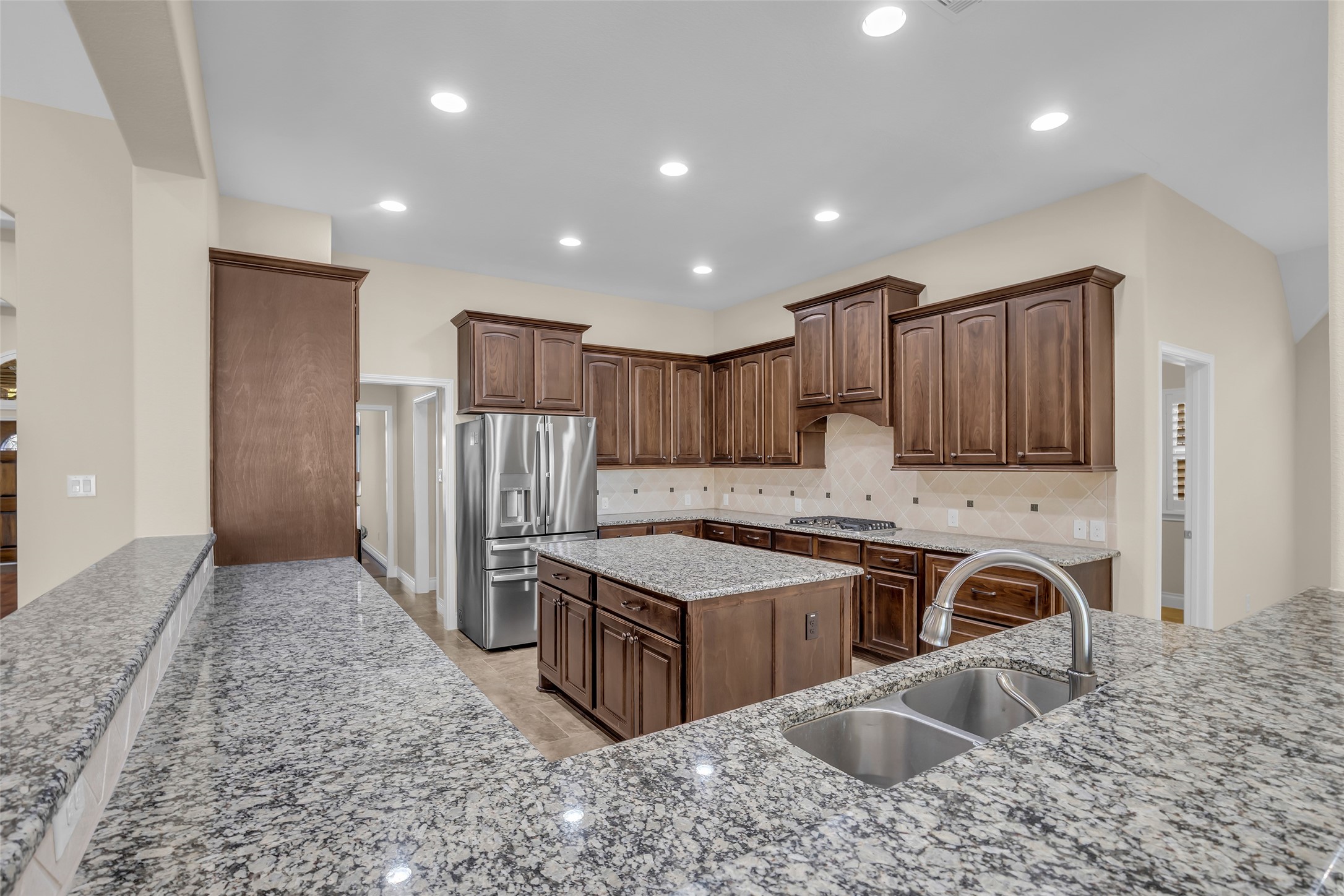 6306 Fisher Bend Lane Rosenberg, TX 77471 - Photo 9 of 26 A central kitchen island adds extra workspace and creates a convenient spot for casual dining.