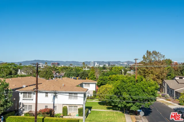 a view of a city with a building in the background