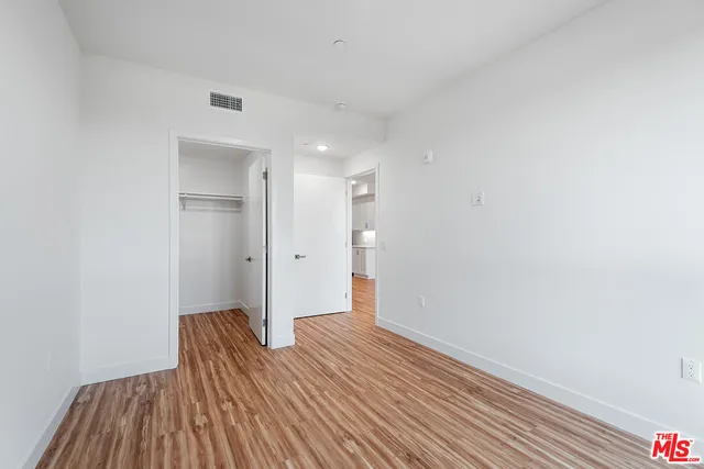 a view of room with wooden floor