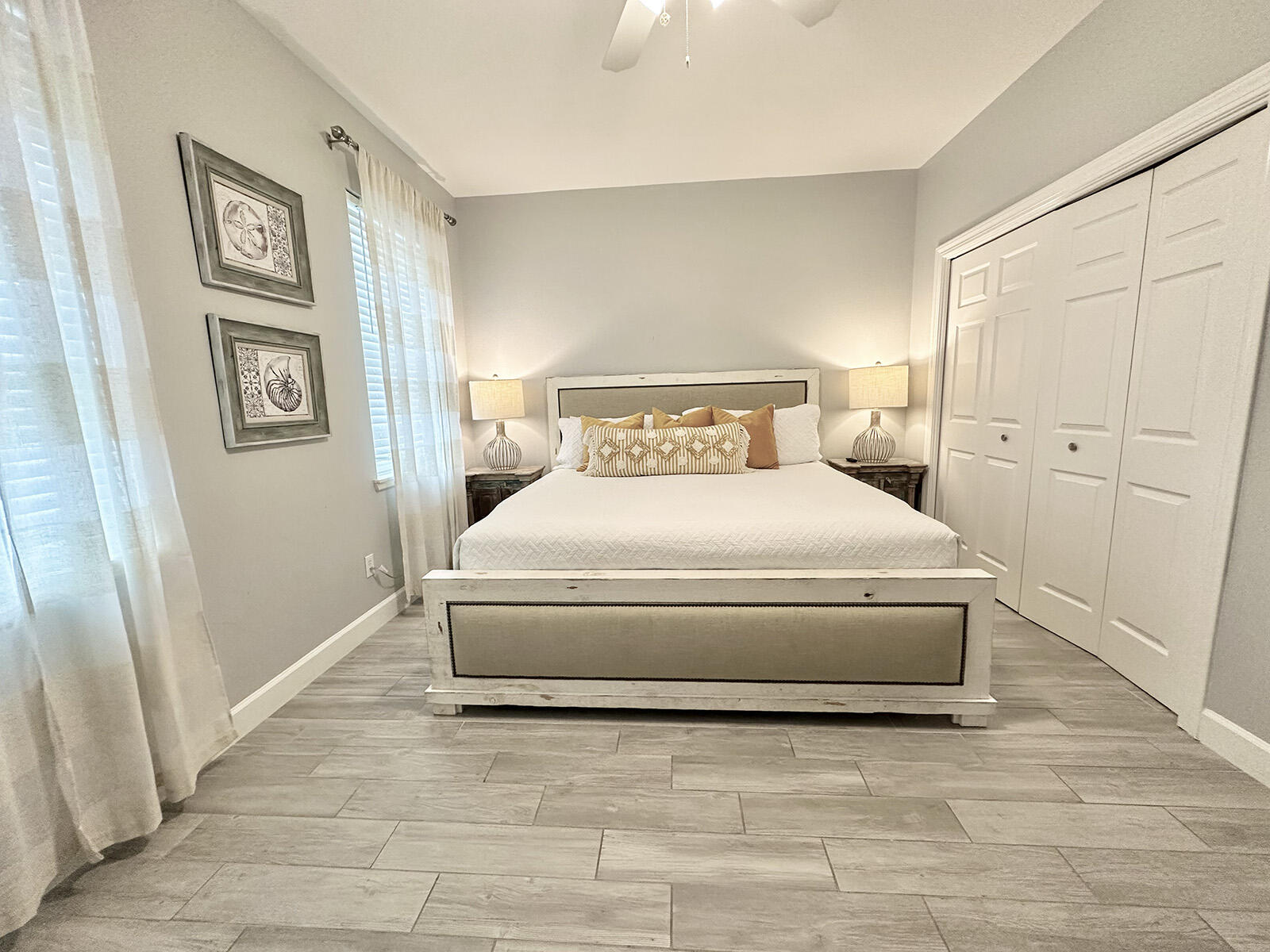 83 Sunfish Street Destin, FL 32541 - Photo 46 of 56 a bedroom with a bed and painting on the wall