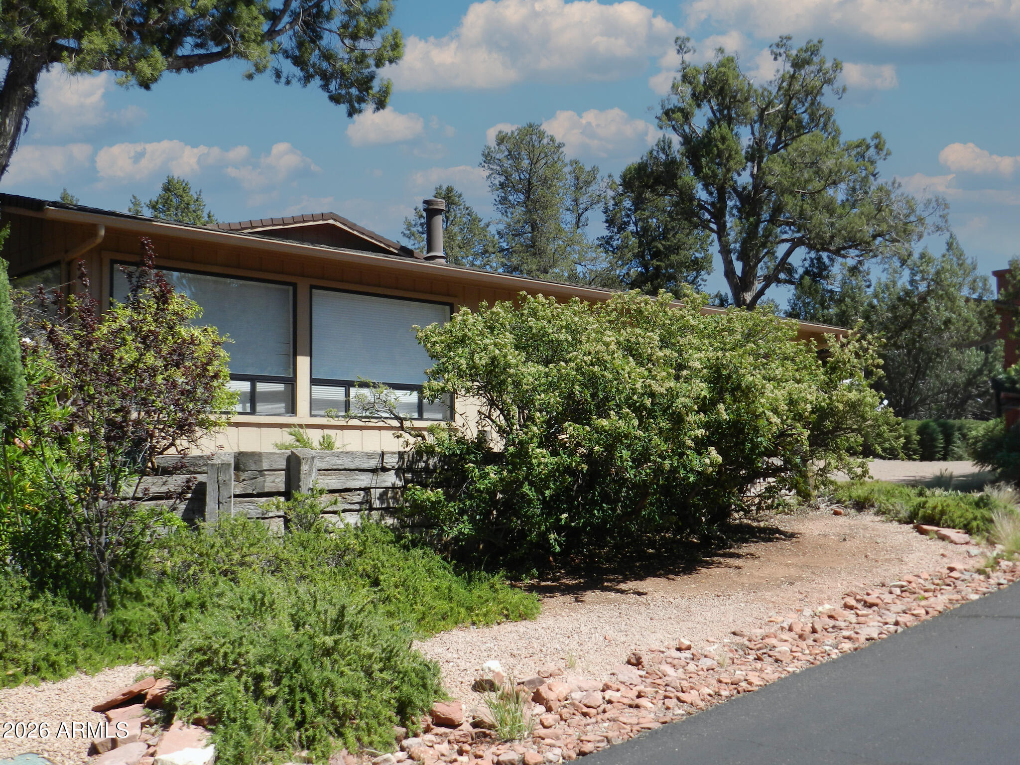 550 Barcelona Road Sedona, AZ 86336 - Photo 31 of 32 a view of a house with a yard