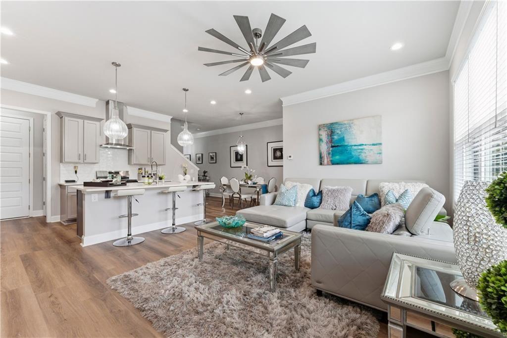 3360 Sarah Trail, Unit 1 Decatur, GA 30032 - Photo 15 of 41 a living room with kitchen island furniture and a kitchen view