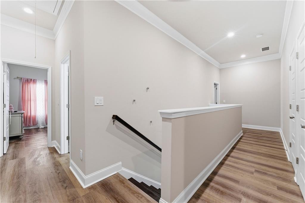 3360 Sarah Trail, Unit 1 Decatur, GA 30032 - Photo 17 of 41 a view of a hallway with wooden floor