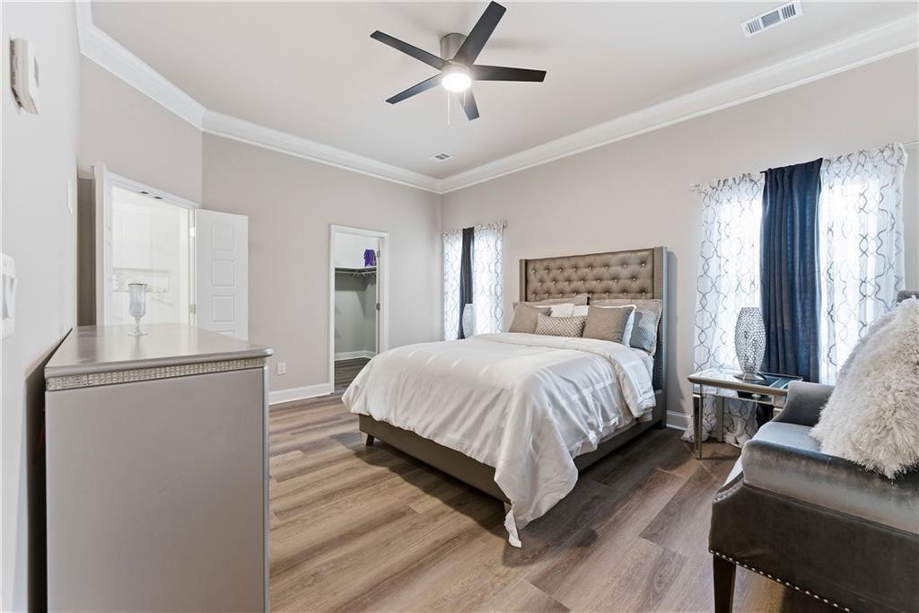 3360 Sarah Trail, Unit 1 Decatur, GA 30032 - Photo 18 of 41 a spacious bedroom with a bed and furniture