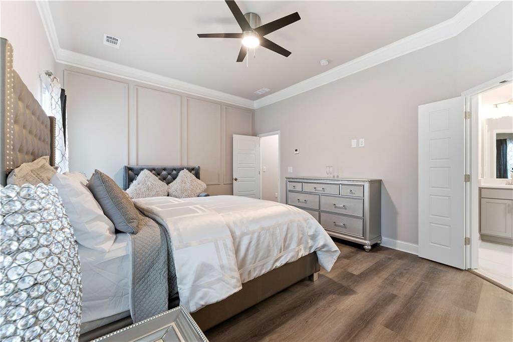3360 Sarah Trail, Unit 1 Decatur, GA 30032 - Photo 19 of 41 a bedroom with a bed and a chandelier