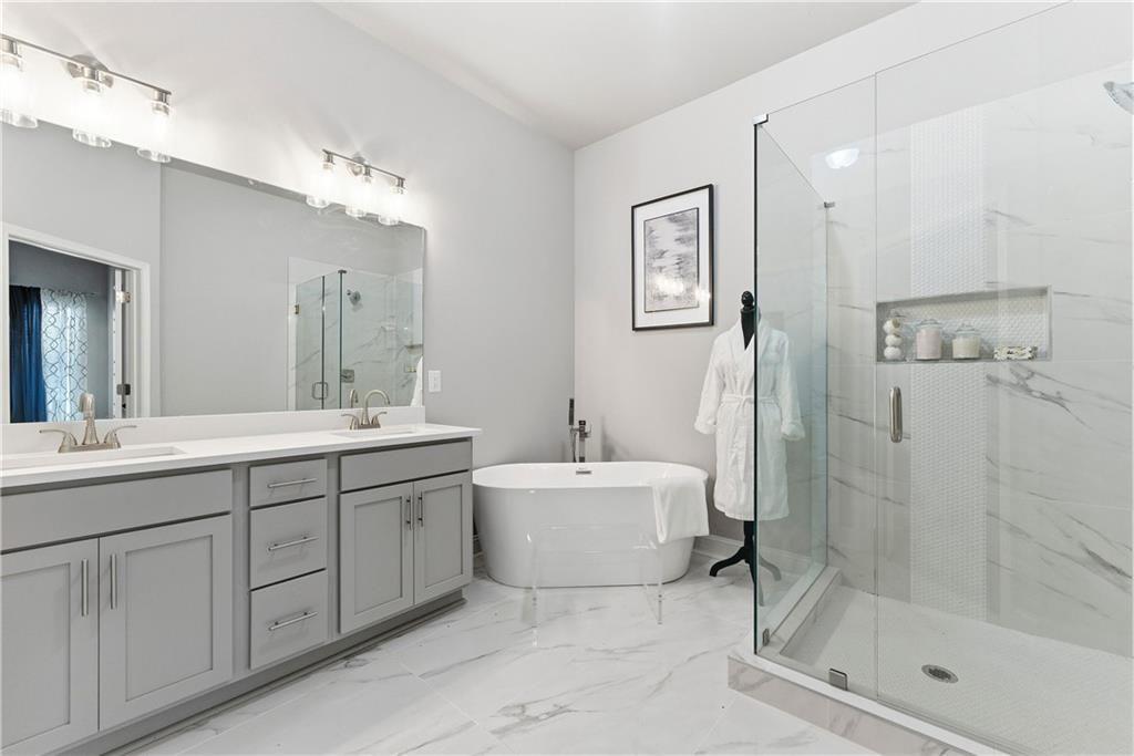 3360 Sarah Trail, Unit 1 Decatur, GA 30032 - Photo 20 of 41 a spacious bathroom with a double vanity sink mirror and shower
