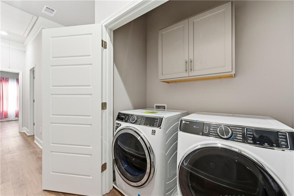 3360 Sarah Trail, Unit 1 Decatur, GA 30032 - Photo 22 of 41 a utility room with dryer and washer