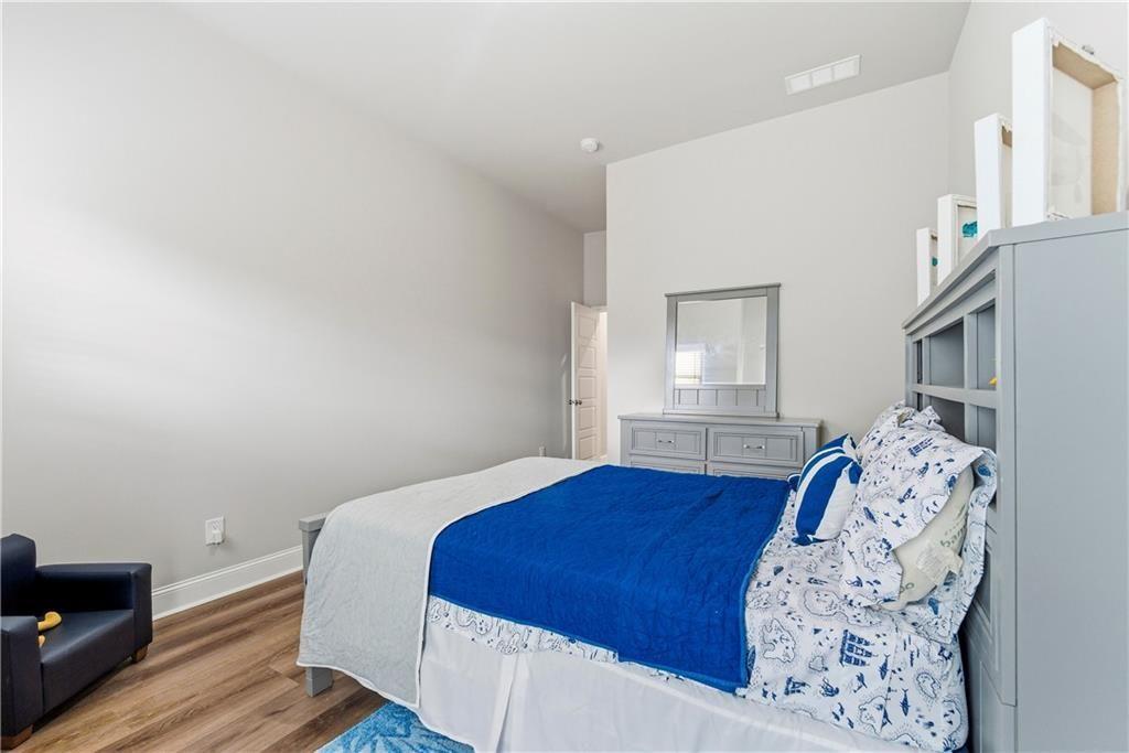 3360 Sarah Trail, Unit 1 Decatur, GA 30032 - Photo 26 of 41 a bedroom with a bed and a window