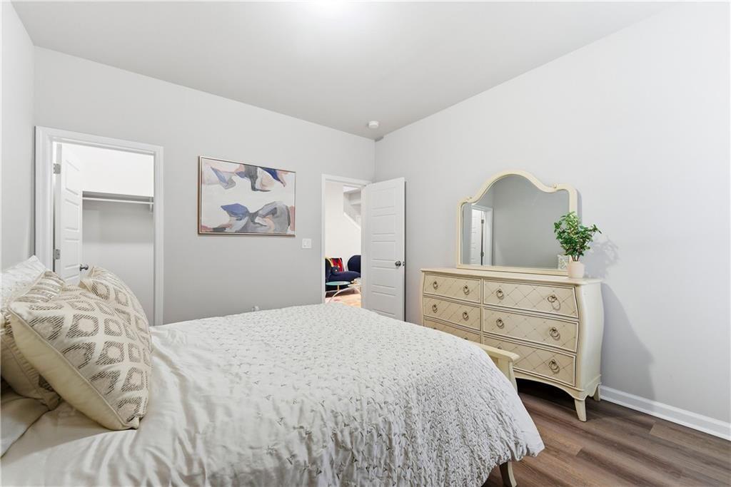 3360 Sarah Trail, Unit 1 Decatur, GA 30032 - Photo 30 of 41 a bedroom with a bed and a dresser