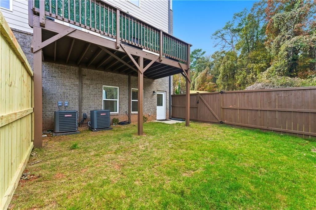 3360 Sarah Trail, Unit 1 Decatur, GA 30032 - Photo 32 of 41 a backyard of a house with table and chairs