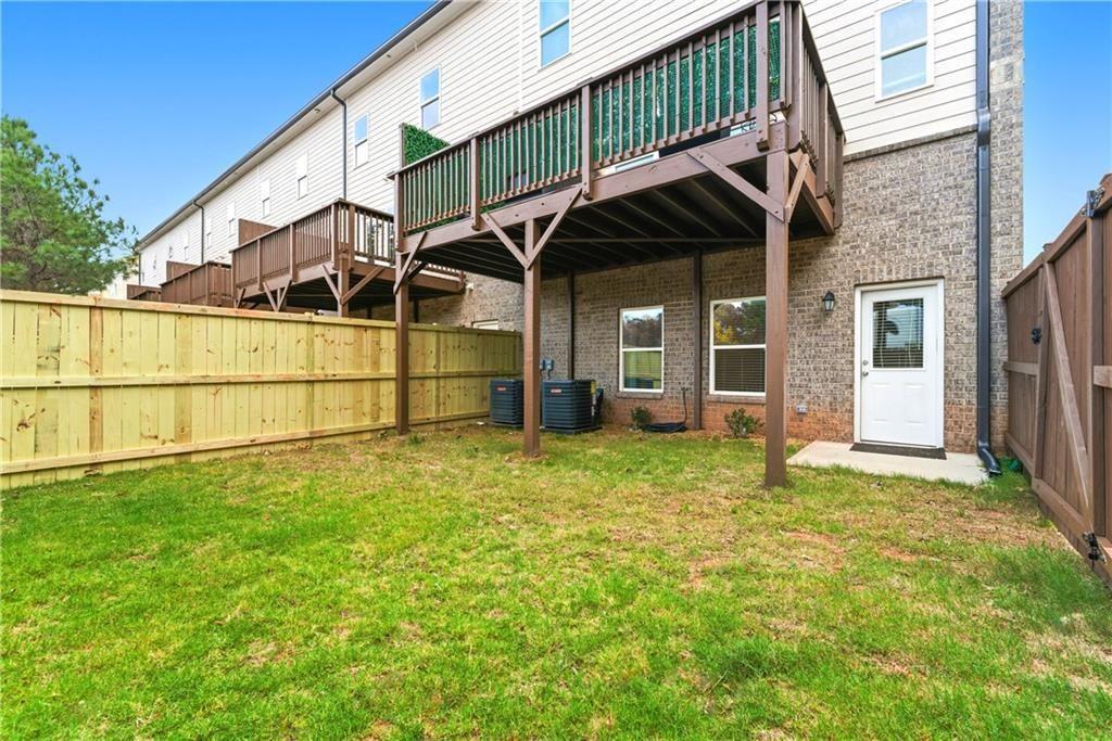3360 Sarah Trail, Unit 1 Decatur, GA 30032 - Photo 33 of 41 a house with green field in front of it