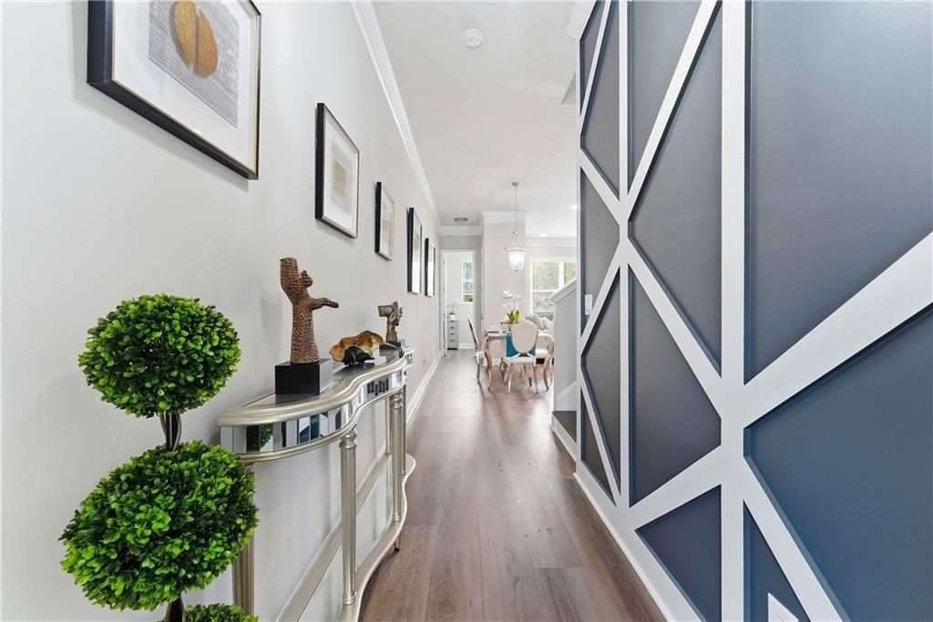 3360 Sarah Trail, Unit 1 Decatur, GA 30032 - Photo 4 of 41 a view of a hallway with wooden floor and stairs