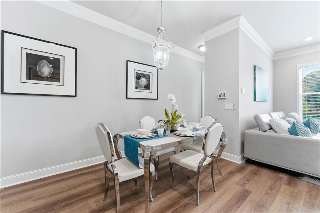 3360 Sarah Trail, Unit 1 Decatur, GA 30032 - Photo 6 of 41 a dining room with furniture and wooden floor