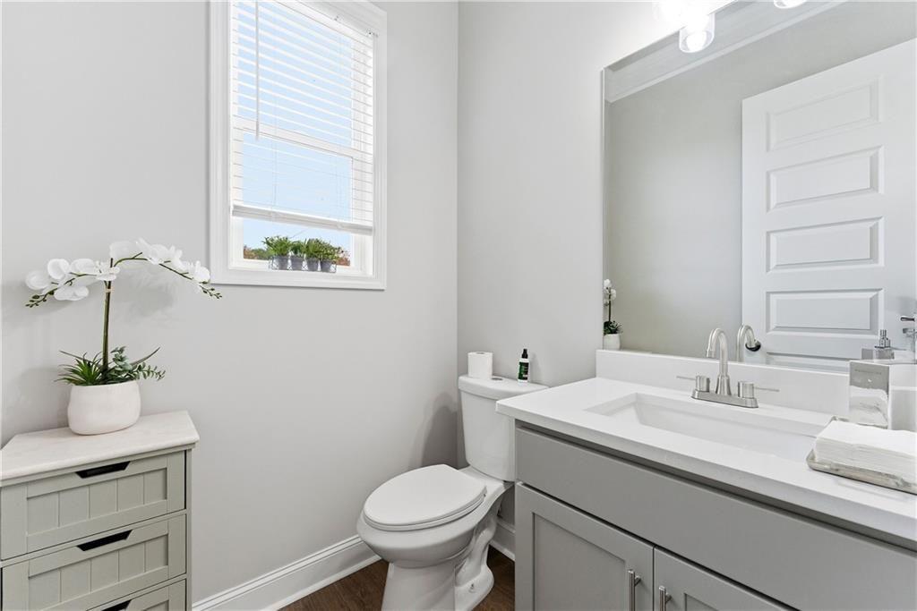 3360 Sarah Trail, Unit 1 Decatur, GA 30032 - Photo 8 of 41 a bathroom with a sink toilet and a mirror