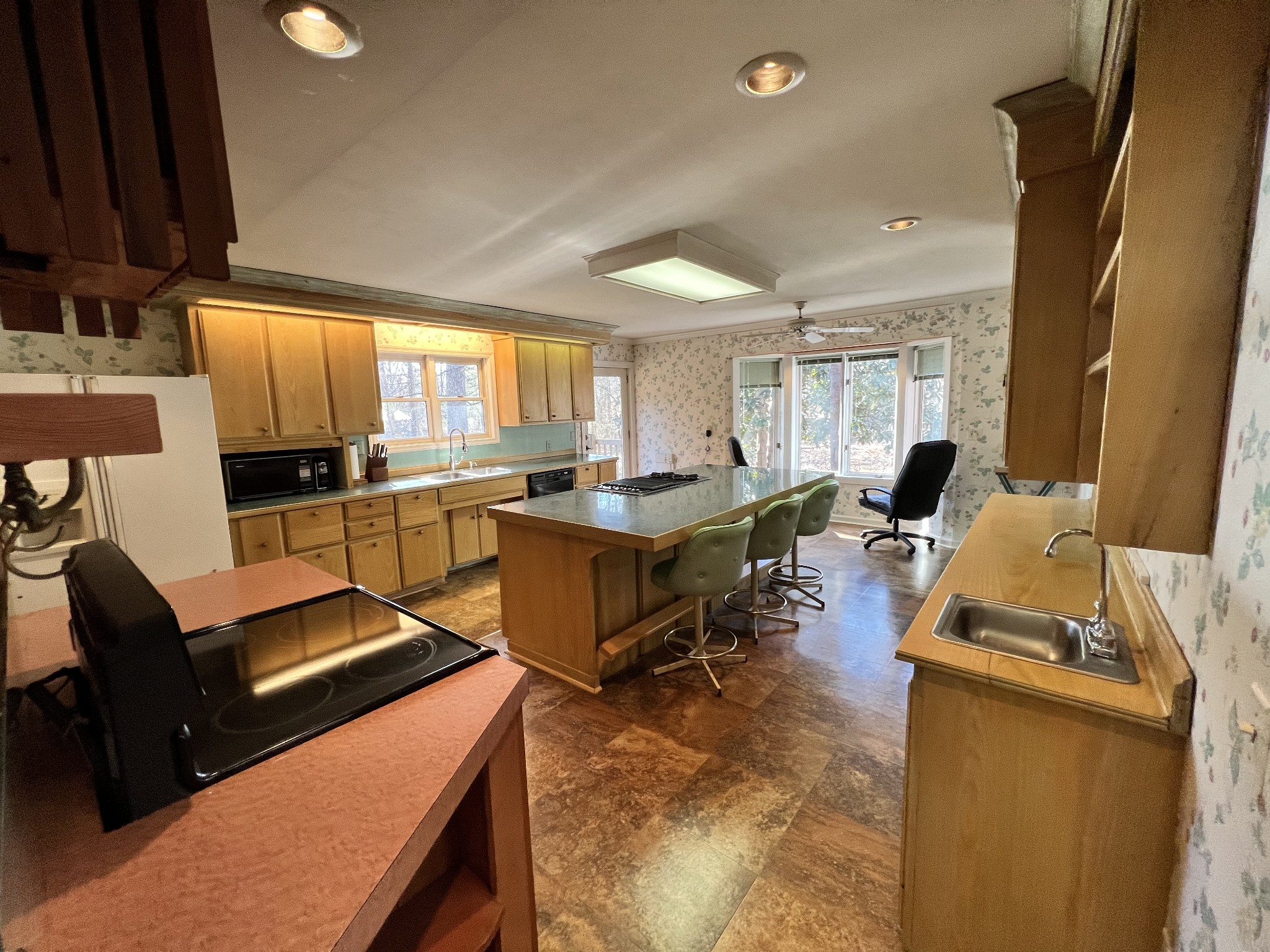 499 Willow Oak Road Manchester, TN 37355 - Photo 10 of 26 a living room with furniture a flat screen tv and a sink