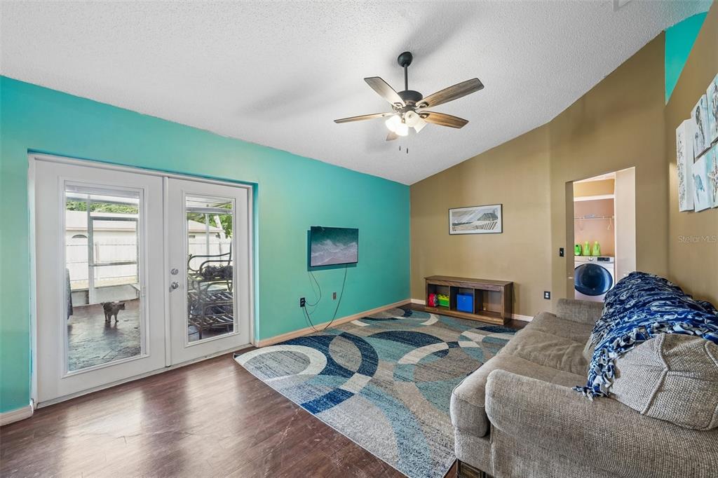10303 Fordham Street Spring Hill, FL 34608 - Photo 9 of 25 a bedroom with a large bed and a window