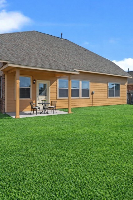 6047 Northcrest Village Way Spring, TX 77388 - Photo 25 of 30 Digitally staged primary covered patio to show use of space & design potential. Digitally enhanced grass.
