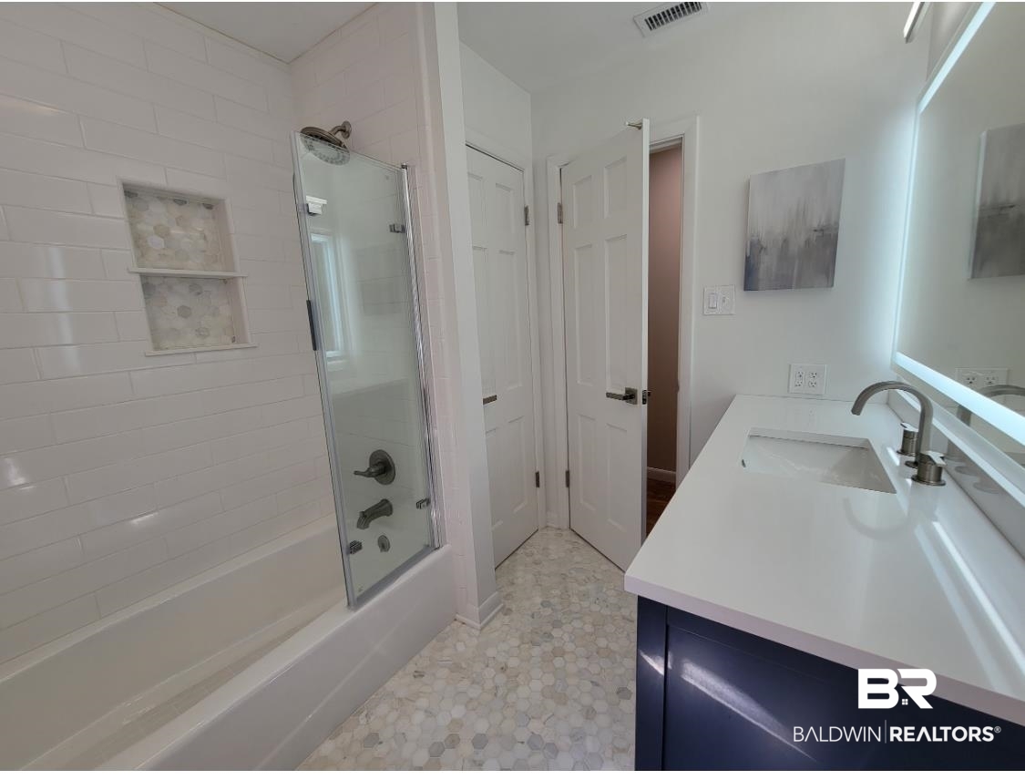 159 Conway Drive West Mobile, AL 36608 - Photo 18 of 24 Full bath featuring shower / bath combination with glass door and vanity