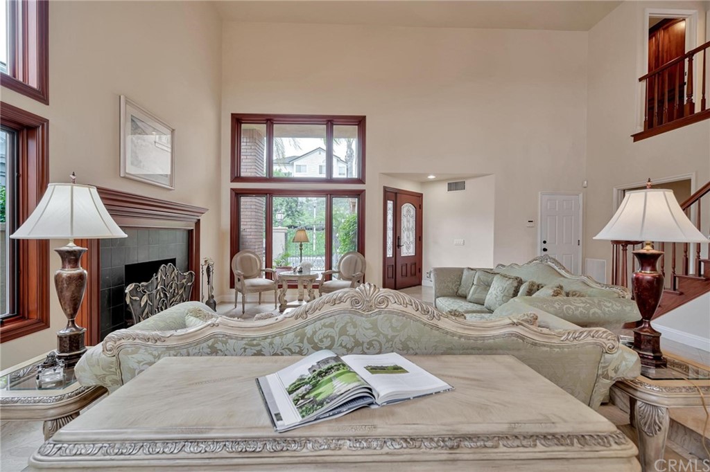 14 Camberley Laguna Niguel, CA 92677 - Photo 23 of 69 a living room with furniture and a fireplace