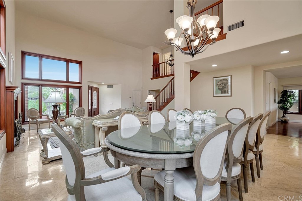 14 Camberley Laguna Niguel, CA 92677 - Photo 24 of 69 a view of a dining room with furniture a chandelier and wooden floor