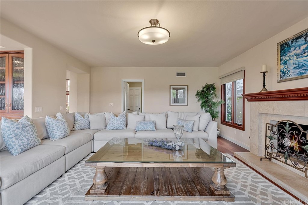 14 Camberley Laguna Niguel, CA 92677 - Photo 25 of 69 a living room with furniture and a fireplace