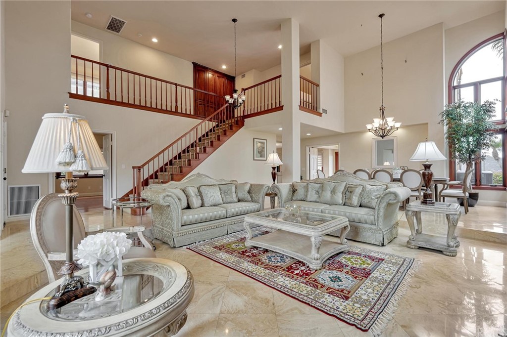 14 Camberley Laguna Niguel, CA 92677 - Photo 28 of 69 a living room with furniture a chandelier and a rug