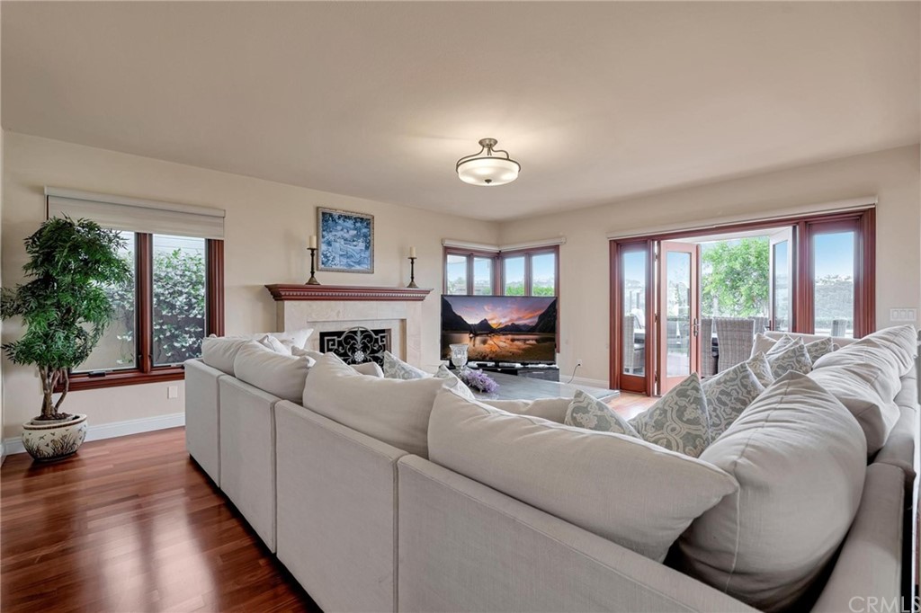 14 Camberley Laguna Niguel, CA 92677 - Photo 29 of 69 a living room with furniture large window and a fireplace
