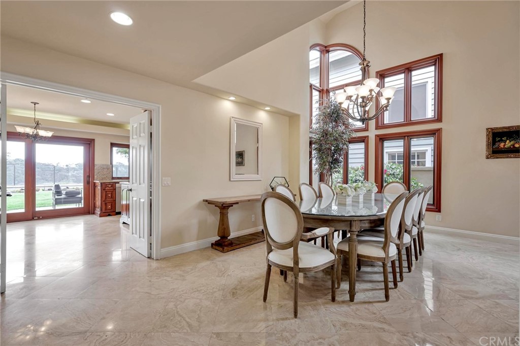 14 Camberley Laguna Niguel, CA 92677 - Photo 32 of 69 a view of a dining room with furniture and a large window