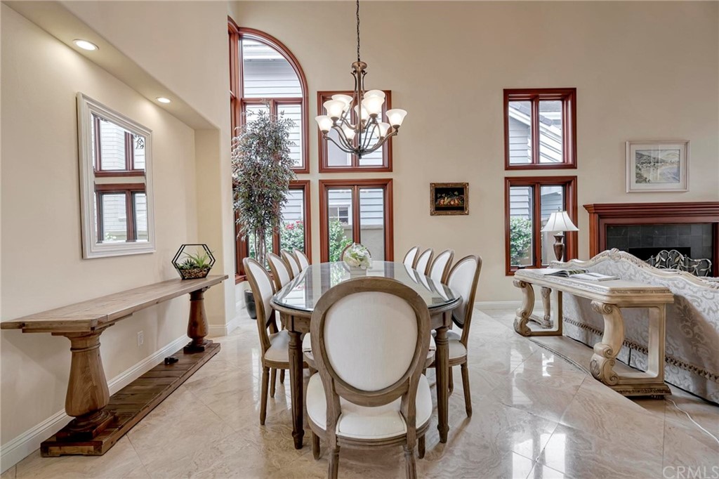 14 Camberley Laguna Niguel, CA 92677 - Photo 33 of 69 a view of a dining room with furniture window and wooden floor