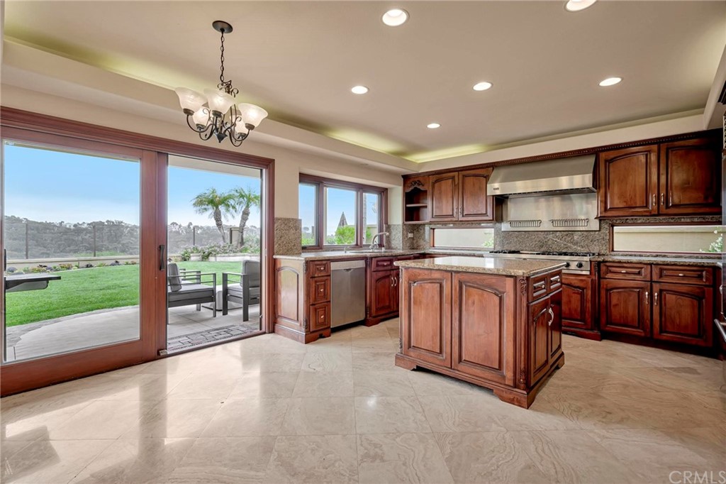 14 Camberley Laguna Niguel, CA 92677 - Photo 36 of 69 a kitchen with a stove a sink and a refrigerator