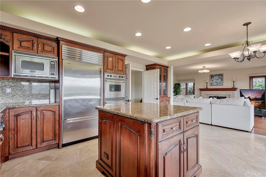 14 Camberley Laguna Niguel, CA 92677 - Photo 39 of 69 a kitchen with stainless steel appliances granite countertop a sink a refrigerator and a stove