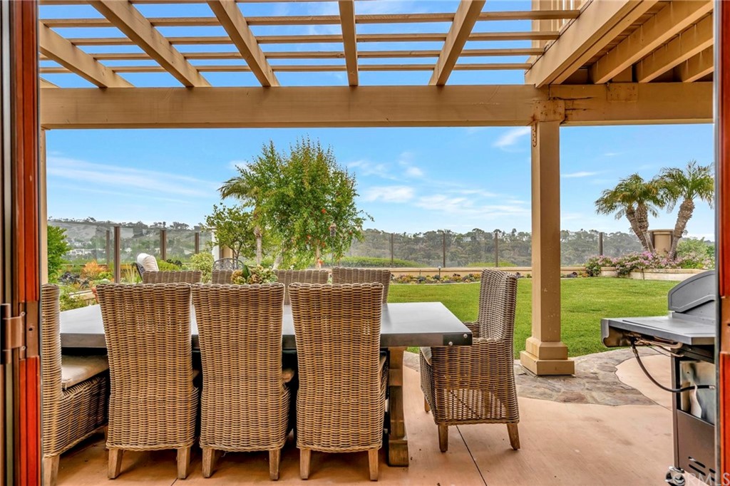 14 Camberley Laguna Niguel, CA 92677 - Photo 41 of 69 a view of a chairs and table in patio with a lake view