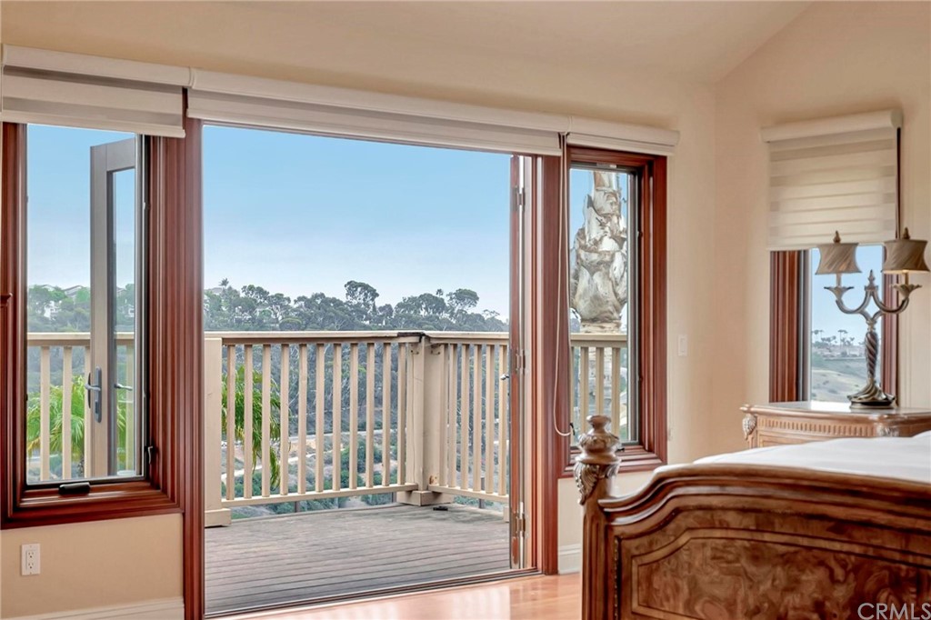 14 Camberley Laguna Niguel, CA 92677 - Photo 49 of 69 a bedroom with a bed and a large window with outer view